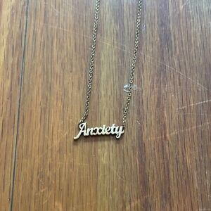 Ban.do Gold Tone Necklace with 'Anxiety' Pendant